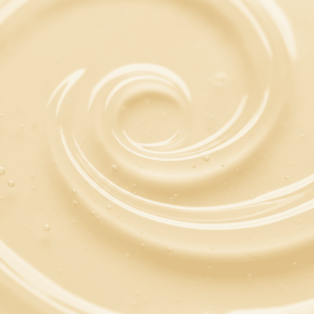 Warm pale yellow emulsion with a soft swirl